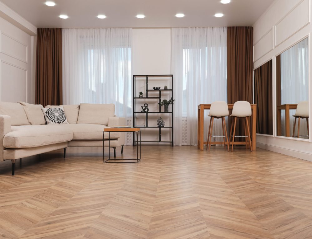 Modern living room with parquet flooring and stylish furniture